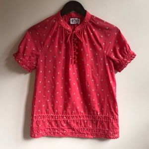 Juicy Couture coral-colored blouse.